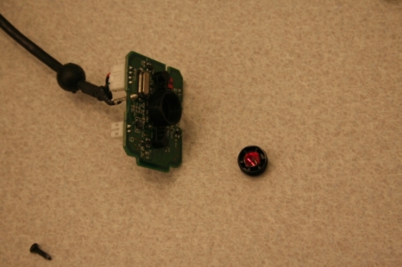 Disassembled webcam with IR notch filter on lens